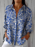 Viviana – Blusa azul con estampado floral